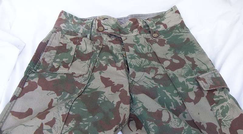A PAIR OF VINTAGE 1970`S - 1980`S SOUTH AFRICAN POLICE COMBAT TROUSERS - NO SIGNS OF USE