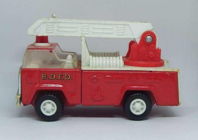 A VINTAGE MOSTLY METAL TOY FIRE TRUCK