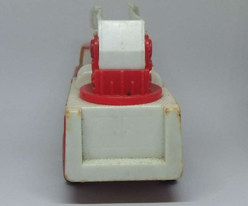A VINTAGE MOSTLY METAL TOY FIRE TRUCK