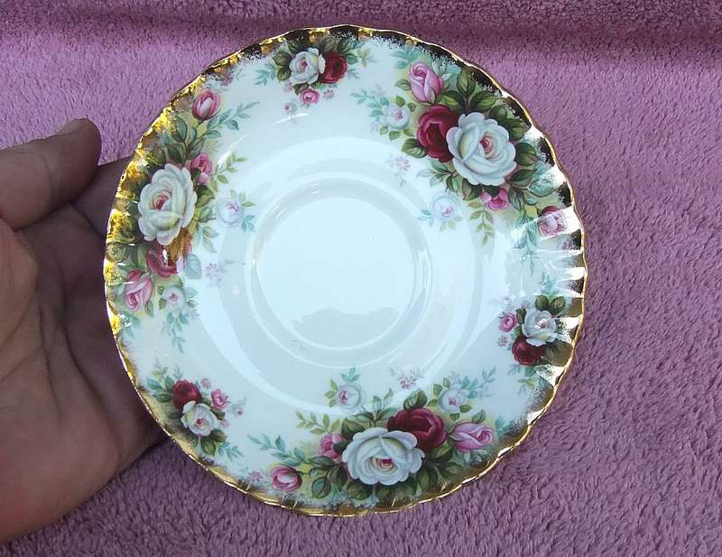 A VINTAGE ROYAL ALBERT DUO - CUP & SAUCER IN THE CELEBRATION PATTERN