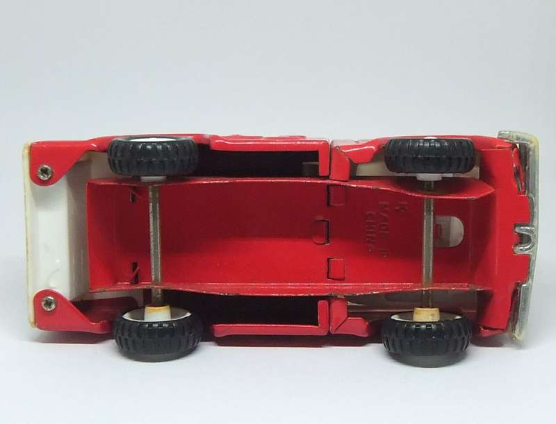 A VINTAGE MOSTLY METAL TOY FIRE TRUCK