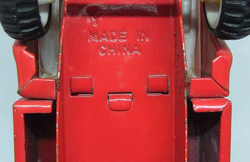 A VINTAGE MOSTLY METAL TOY FIRE TRUCK