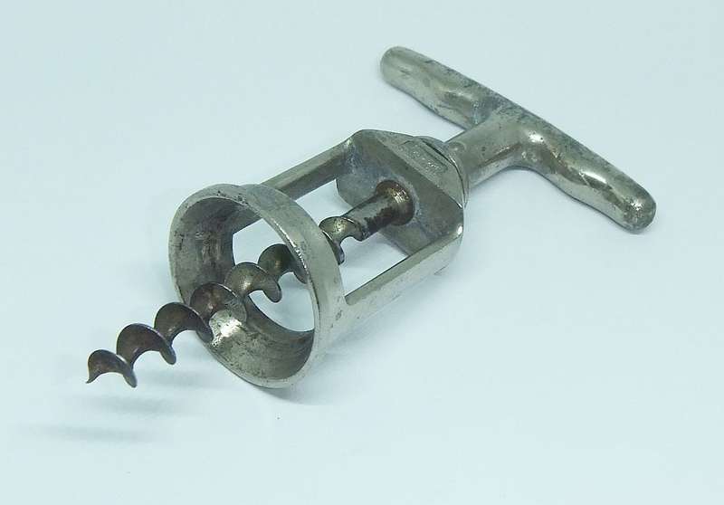 A VINTAGE METAL CORKSCREW MADE BY LADOR OF SWITZERLAND