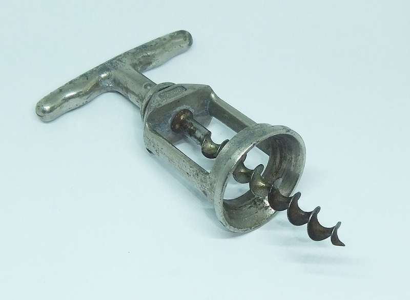 A VINTAGE METAL CORKSCREW MADE BY LADOR OF SWITZERLAND