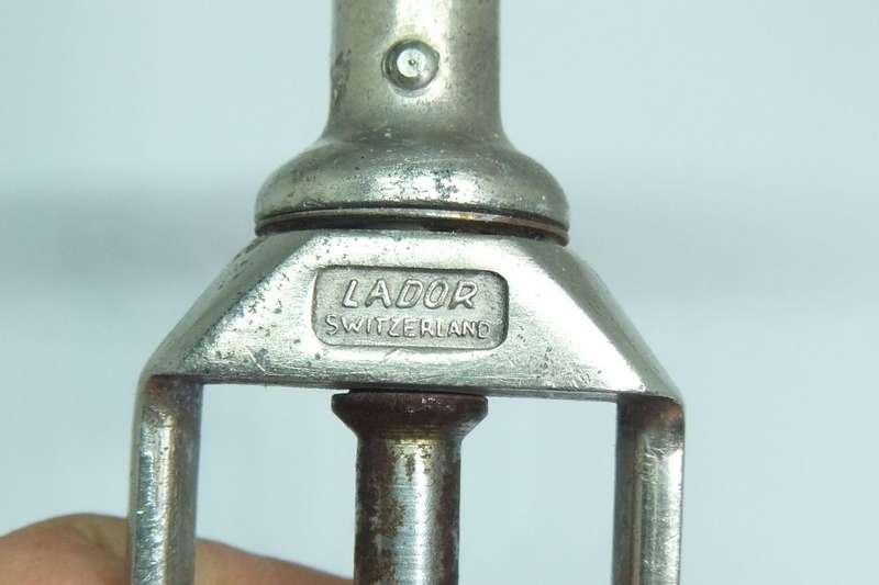 A VINTAGE METAL CORKSCREW MADE BY LADOR OF SWITZERLAND