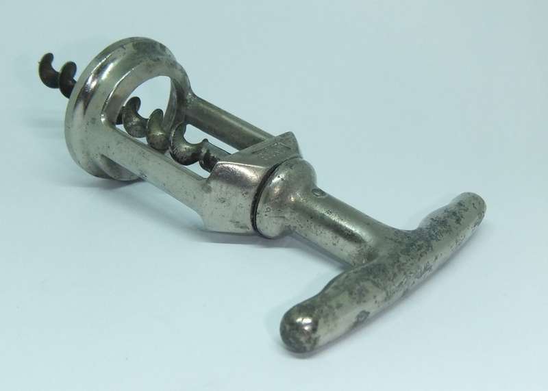 A VINTAGE METAL CORKSCREW MADE BY LADOR OF SWITZERLAND
