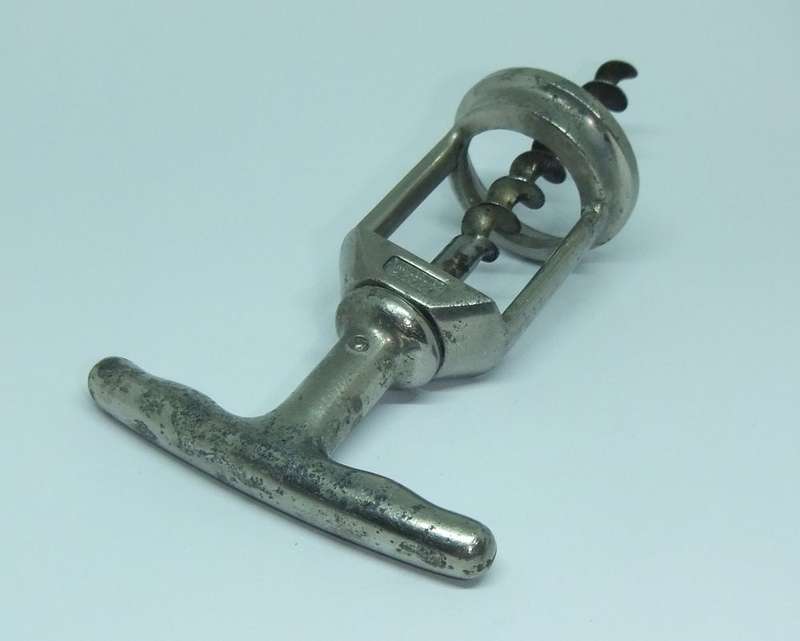 A VINTAGE METAL CORKSCREW MADE BY LADOR OF SWITZERLAND