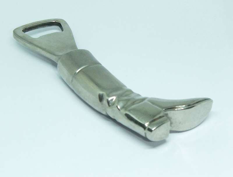 A VINTAGE SOLID METAL BOOT FORM BOTTLE OPENER