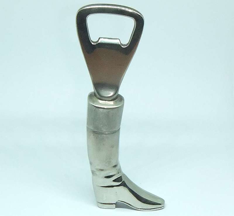 A VINTAGE SOLID METAL BOOT FORM BOTTLE OPENER