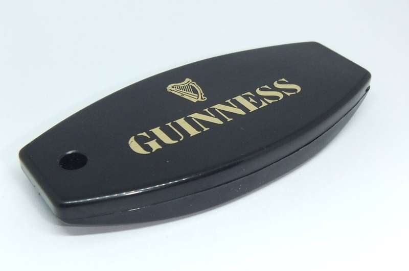 A VINTAGE GUINNESS ADVERTISING BOTTLE OPENER