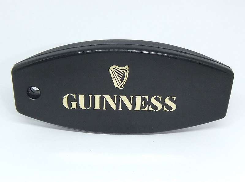 A VINTAGE GUINNESS ADVERTISING BOTTLE OPENER