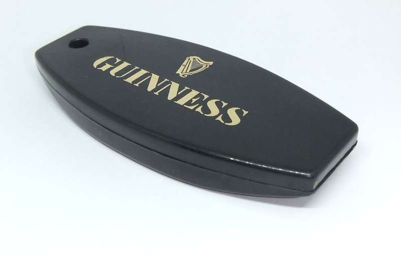A VINTAGE GUINNESS ADVERTISING BOTTLE OPENER