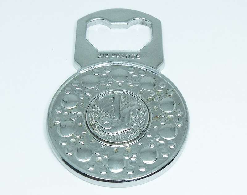 A VINTAGE SOLID METAL BOTTLE OPENER MADE FOR " AIR FRANCE "