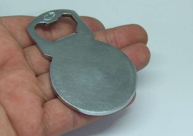 A VINTAGE SOLID METAL BOTTLE OPENER MADE FOR " AIR FRANCE "
