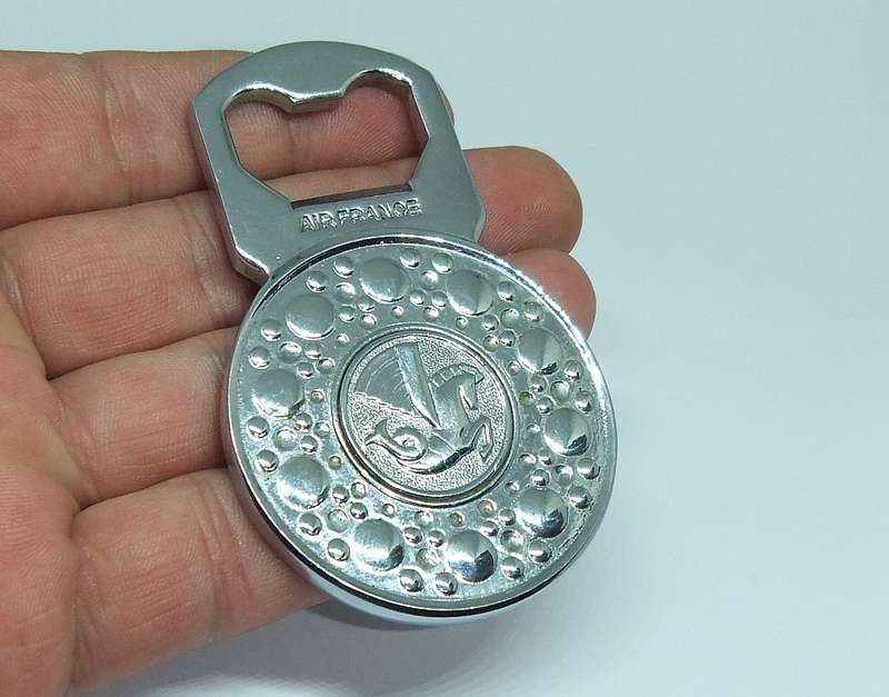 A VINTAGE SOLID METAL BOTTLE OPENER MADE FOR " AIR FRANCE "