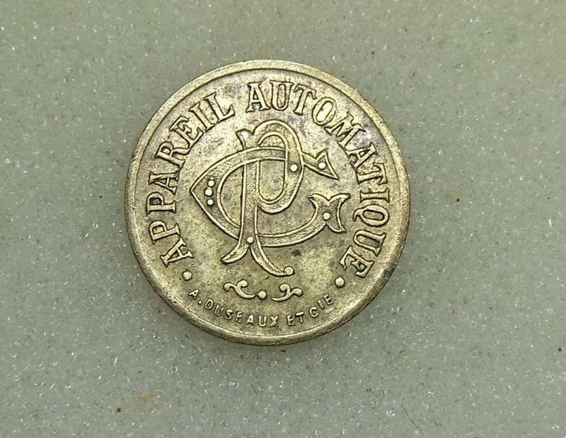 AN ANTIQUE FRENCH 20 CENTIMES CONSUMER TOKEN