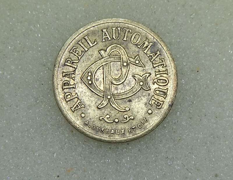 AN ANTIQUE FRENCH 20 CENTIMES CONSUMER TOKEN