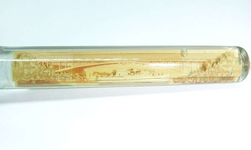 A VINTAGE BOTTLE OPENER FROM THE NIAGARA FALLS CANADA WITH MOVING BOAT FEATURE