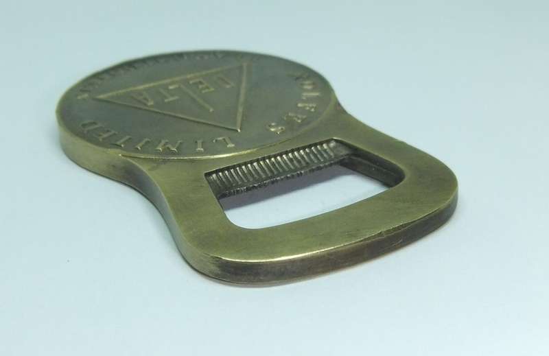 A VINTAGE MINING RELATED SOLID BRONZE BOTTLE OPENER