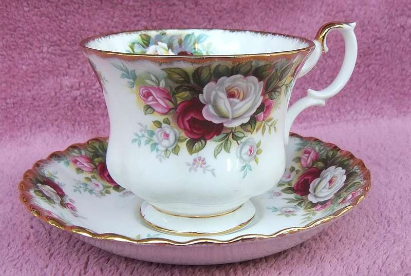A VINTAGE ROYAL ALBERT DUO - CUP & SAUCER IN THE CELEBRATION PATTERN