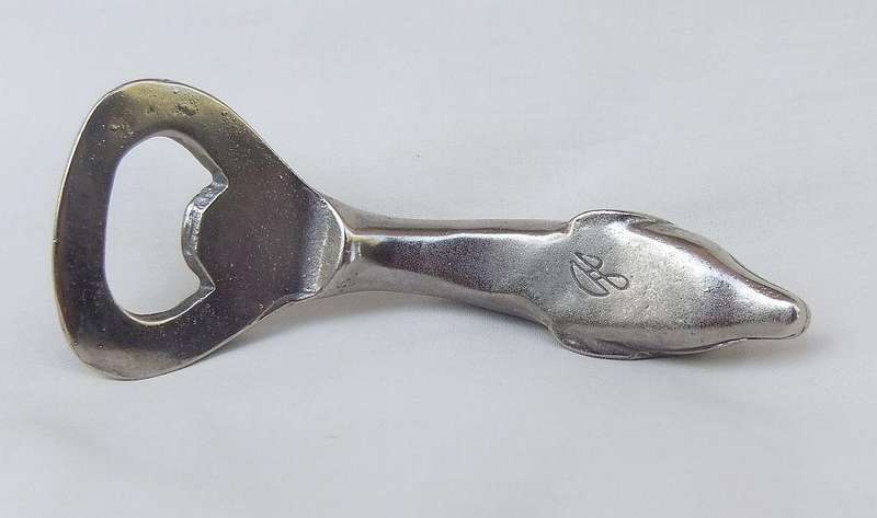 AN ADORABLE SOLID METAL VINTAGE DOLPHIN MOTIF BOTTLE OPENER WITH DESIGNER STAMP !!