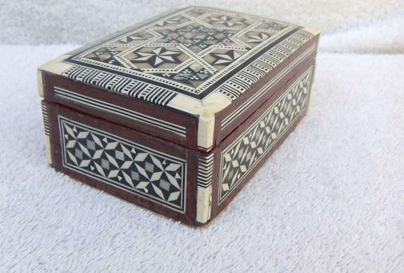 AN OLD MOTHER OF PEARL AND BONE INLAID WOODEN TRINKET BOX