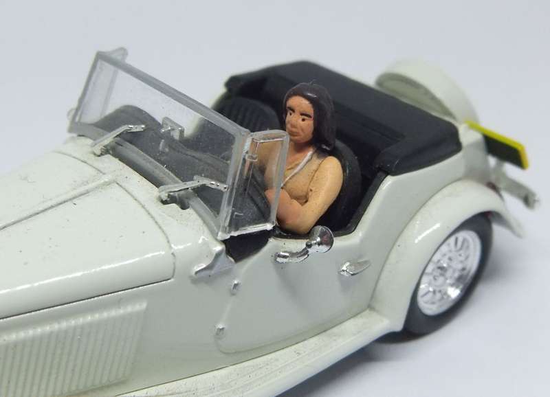 A 1:43 SCALE DIE CAST METAL MODEL OF THE MP LAFER WITH DRIVER