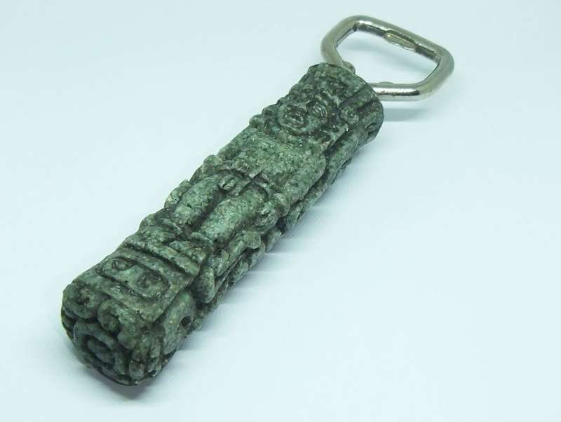 A VINTAGE BOTTLE OPENER WITH AZTEC MOTIF