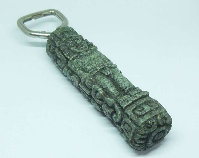 A VINTAGE BOTTLE OPENER WITH AZTEC MOTIF