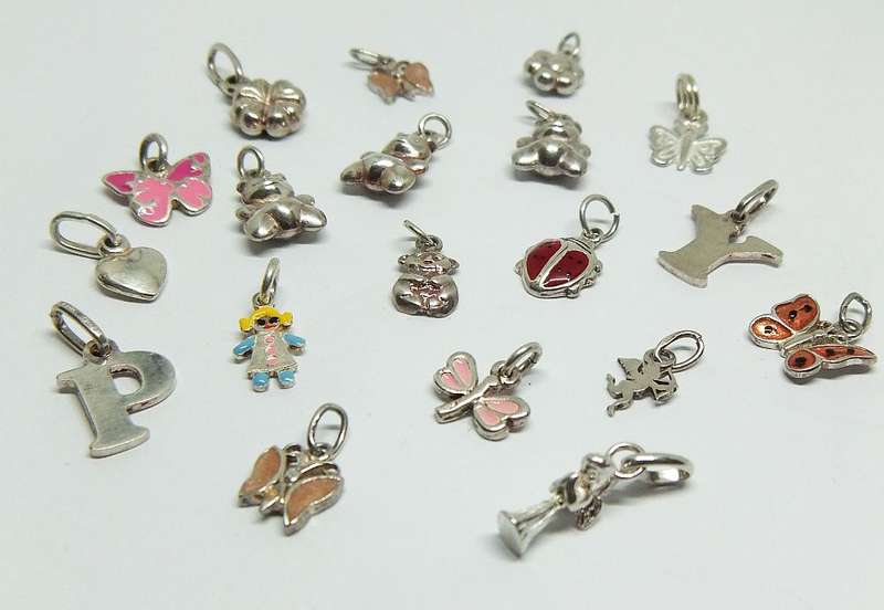 WOW !! AN ADORABLE LOT OF 19 STERLING SILVER CHARMS !! BID FOR THE LOT !!