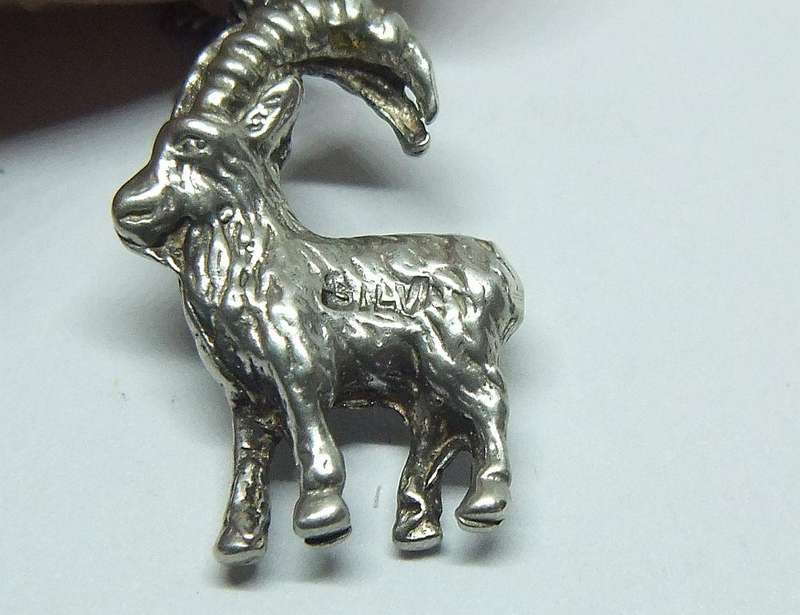 A VINTAGE ITALIAN STERLING SILVER NECKLACE WITH A SOLID GERMAN " 835 "SILVER GOAT PENDANT