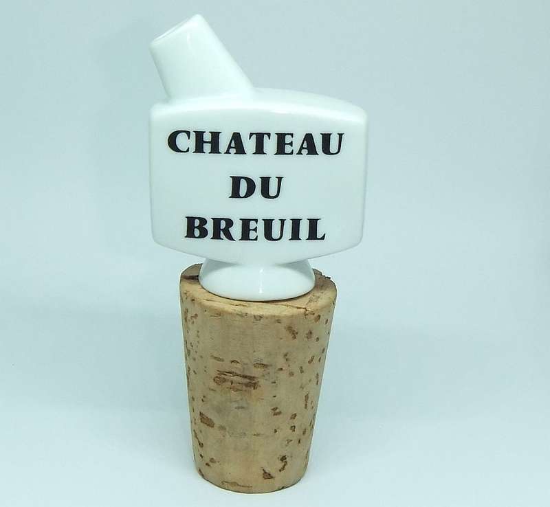 A VINTAGE PORCELAIN AND CORK ALCOHOL POURER