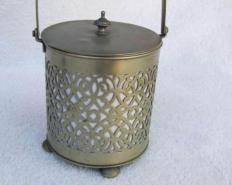 A VICTORIAN ERA PORCELAIN JAR WITH METAL FRAME , HANDLE AND LID MARKED EPNS