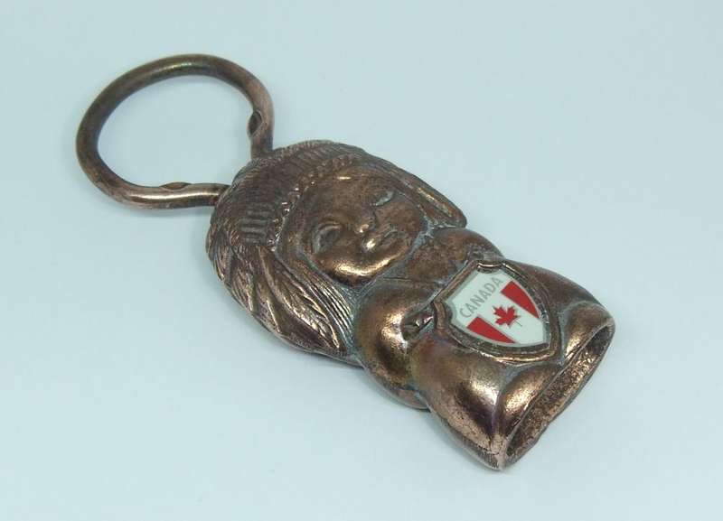 A VINTAGE CANADIAN FIGURAL BOTTLE OPENER