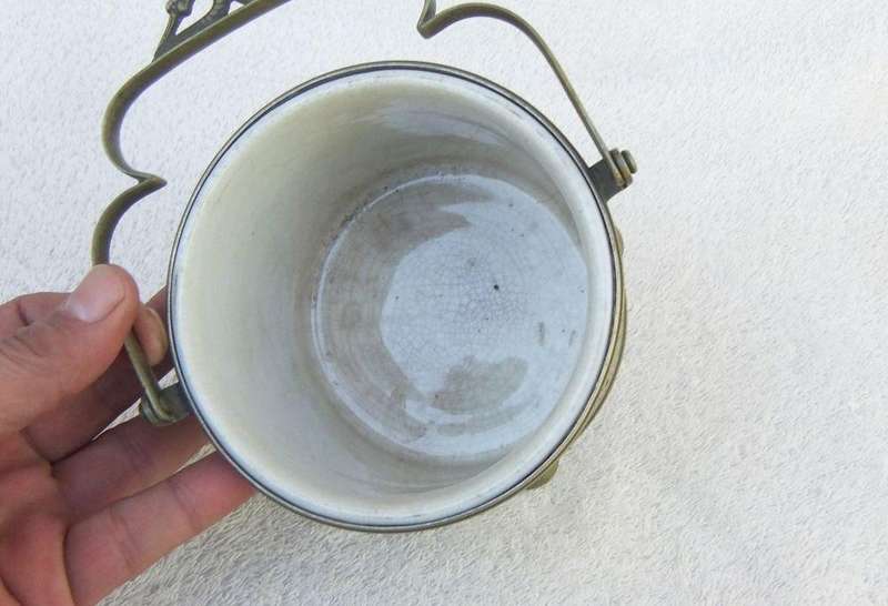 A VICTORIAN ERA PORCELAIN JAR WITH METAL FRAME , HANDLE AND LID MARKED EPNS