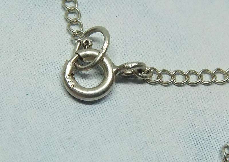 A BRAND NEW STERLING SILVER NECKLACE WITH A VINTAGE STERLING SILVER LION PENDANT MADE IN GERMANY