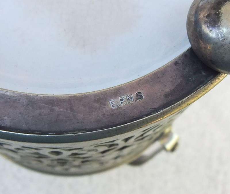 A VICTORIAN ERA PORCELAIN JAR WITH METAL FRAME , HANDLE AND LID MARKED EPNS