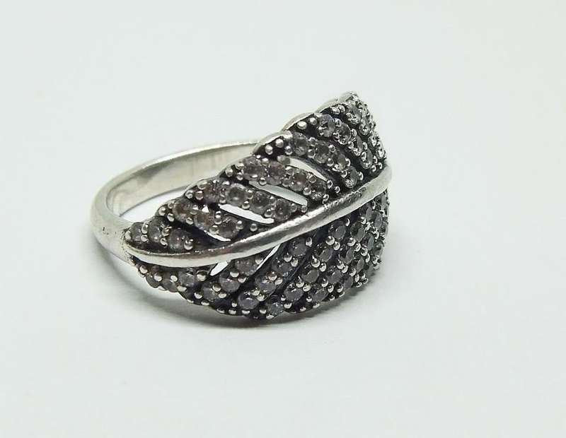 A BEAUTIFUL SOLID STERLING SILVER RING SET WITH OVER 80 FACETED CZ STONES IN EXCELLENT CONDITION !!