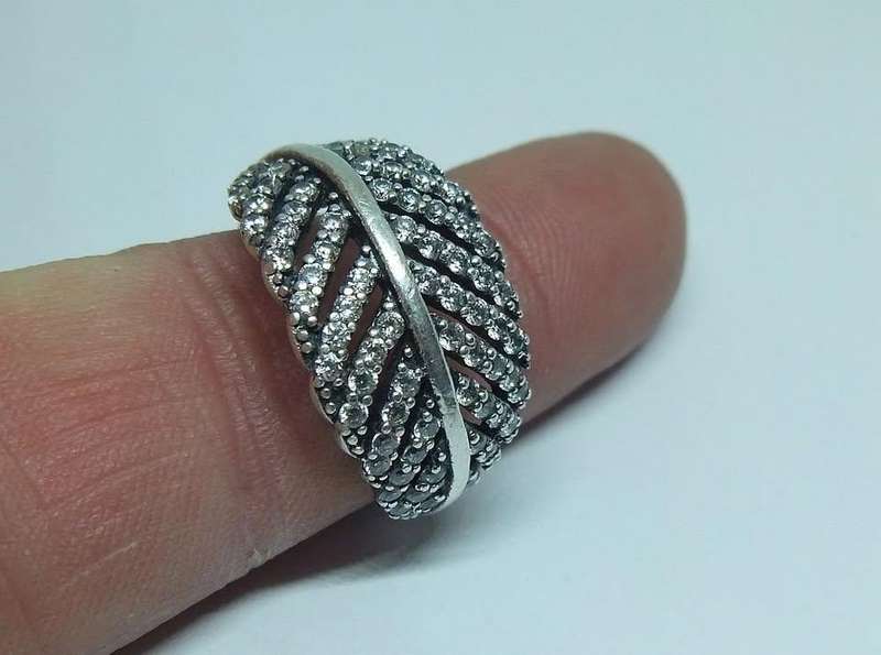 A BEAUTIFUL SOLID STERLING SILVER RING SET WITH OVER 80 FACETED CZ STONES IN EXCELLENT CONDITION !!