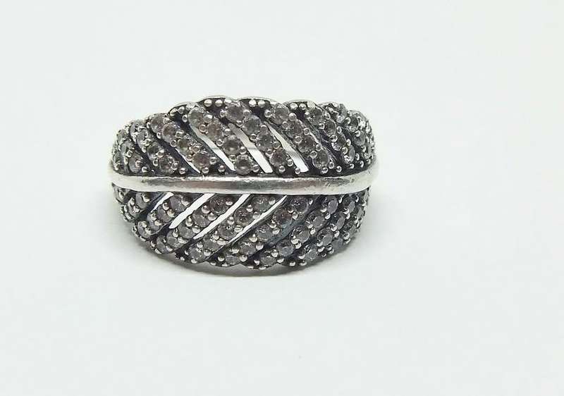 A BEAUTIFUL SOLID STERLING SILVER RING SET WITH OVER 80 FACETED CZ STONES IN EXCELLENT CONDITION !!
