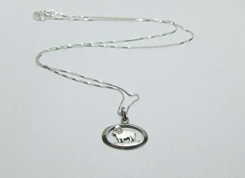 A VINTAGE STERLING SILVER ARIES PENDANT WITH A 42 CM STERLING SILVER NECKLACE !! FREE COMBINING !!