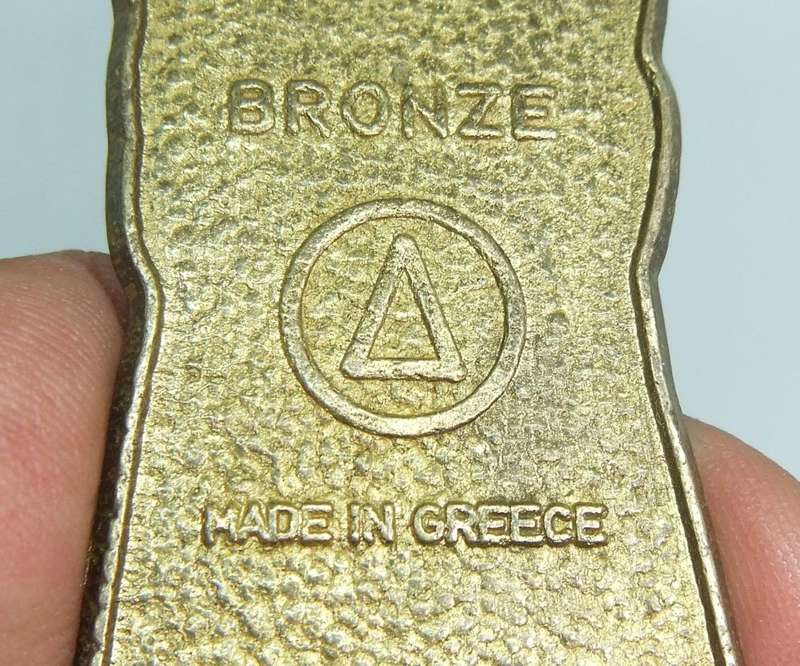 A VINTAGE ENAMEL ON BRONZE LADY FIGURE BOTTLE OPENER MADE IN GREECE