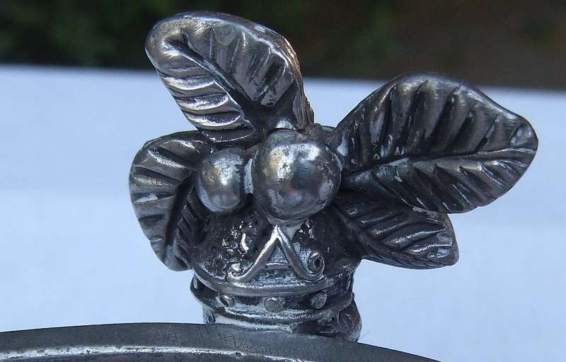 A STYLISH DESIGNER STAMPED COCONUT TREE MOTIF METAL STAND WITH GLASS BOWL