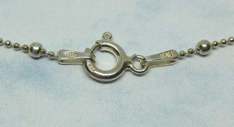 A SOLID STERLING SILVER "BALL" NECKLACE WITH A STERLING SILVER CROWN SHAPED PENDANT