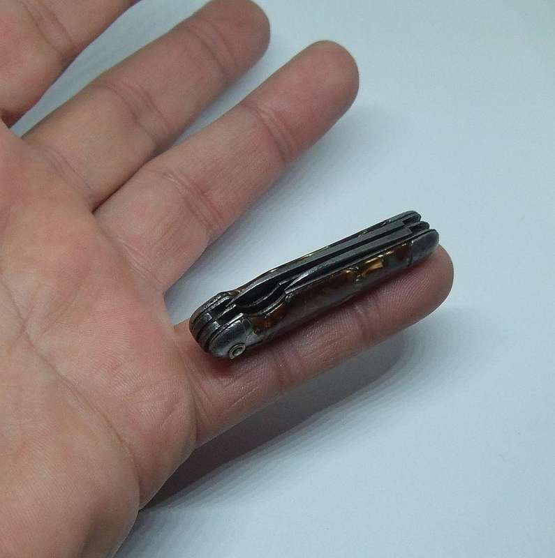 A VERY OLD TICKEY POCKET SIZED KNIFE TOOL USED FOR CLEANING SMOKING PIPES IN THIS CASE ...TOO CUTE !