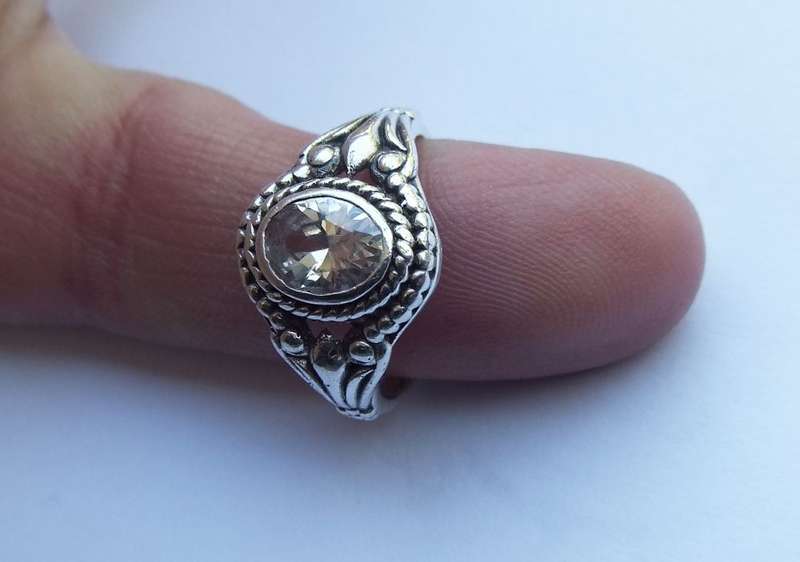 LOOK HERE !! A LOVELY SOLID STERLING SILVER RING SET WITH A FACETED CLEAR CZ STONE !!