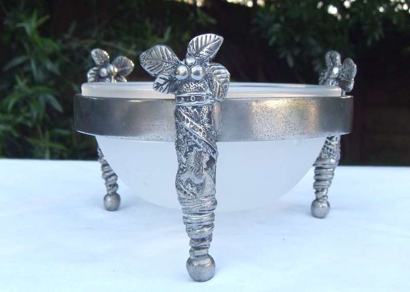 A STYLISH DESIGNER STAMPED COCONUT TREE MOTIF METAL STAND WITH GLASS BOWL