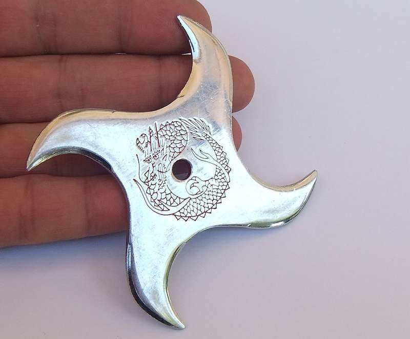 TWO TOTALLY COOL VINTAGE JAPANESE MADE NINJA STARS WITH DRAGON MOTIF !!
