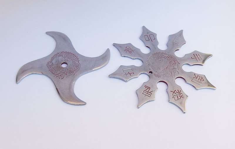TWO TOTALLY COOL VINTAGE JAPANESE MADE NINJA STARS WITH DRAGON MOTIF !!