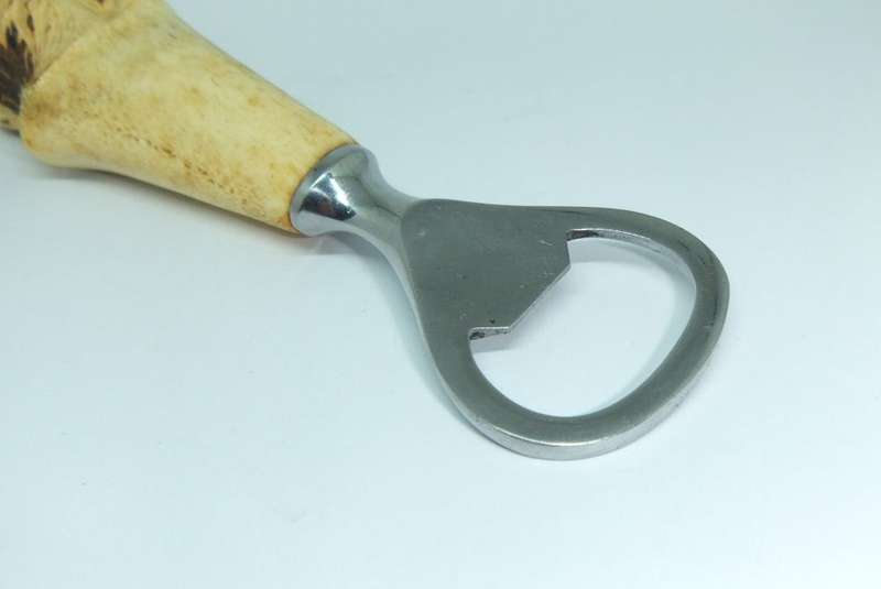 A VINTAGE CARVED BONE DOG MOTIF BOTTLE OPENER BY LEPPINGTON SHEFFIELD ENGLAND